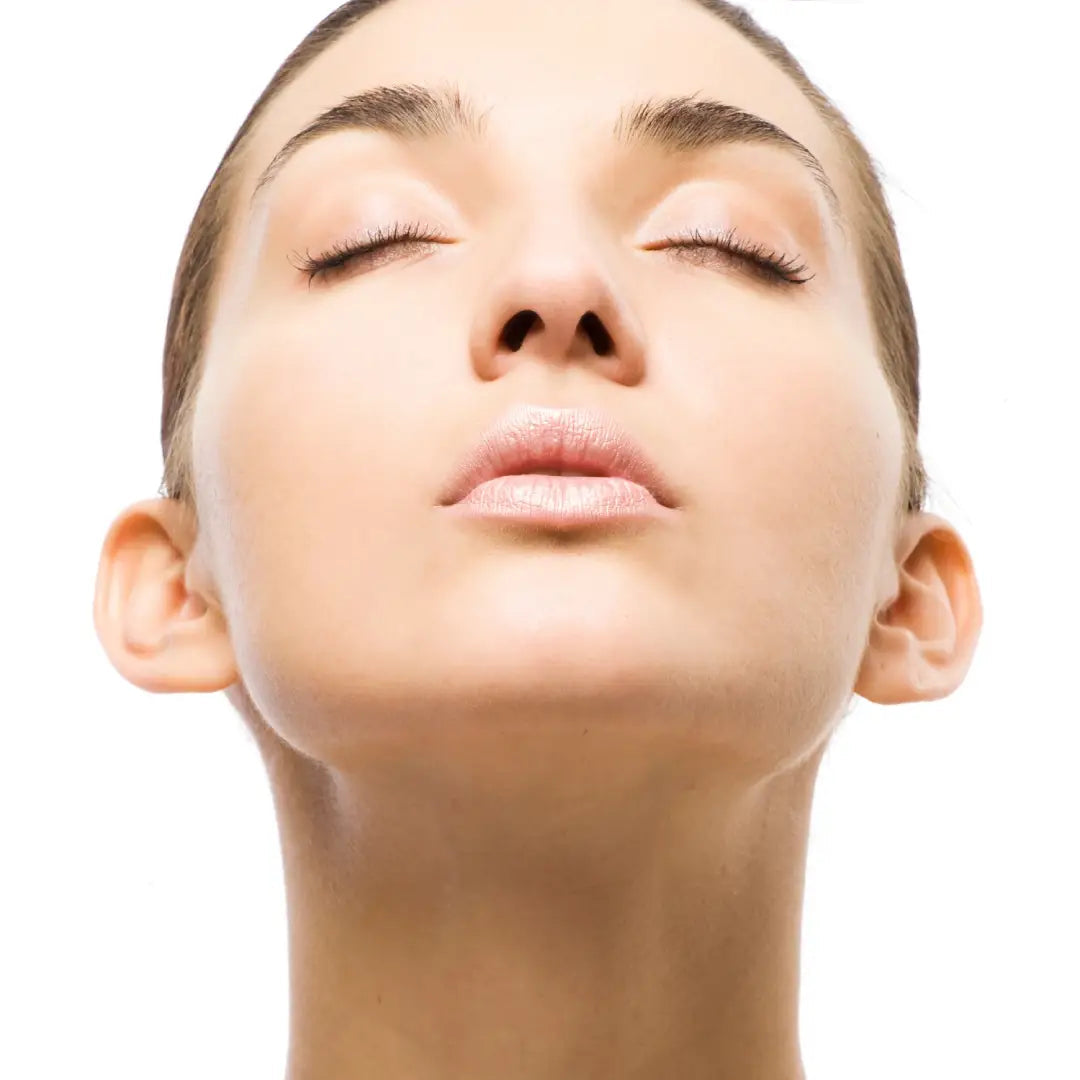 Close-up of a woman's neck and face on a white background