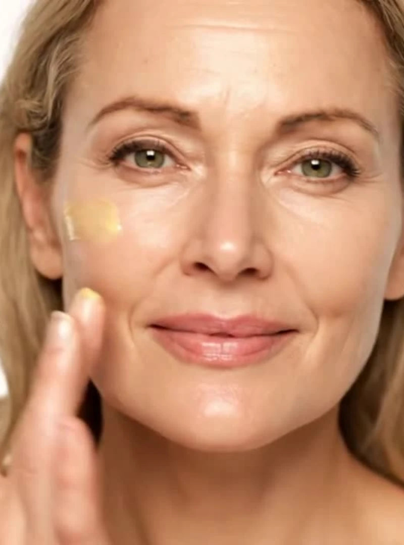 Female model applying by valenti bakuchiol night repair cream to her face