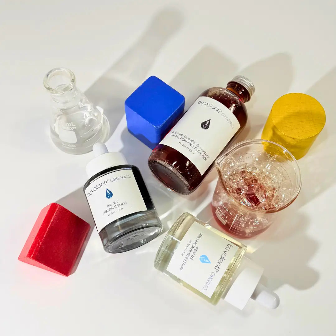 Collection of skincare products from BY VALENTI with visible labels on a white background