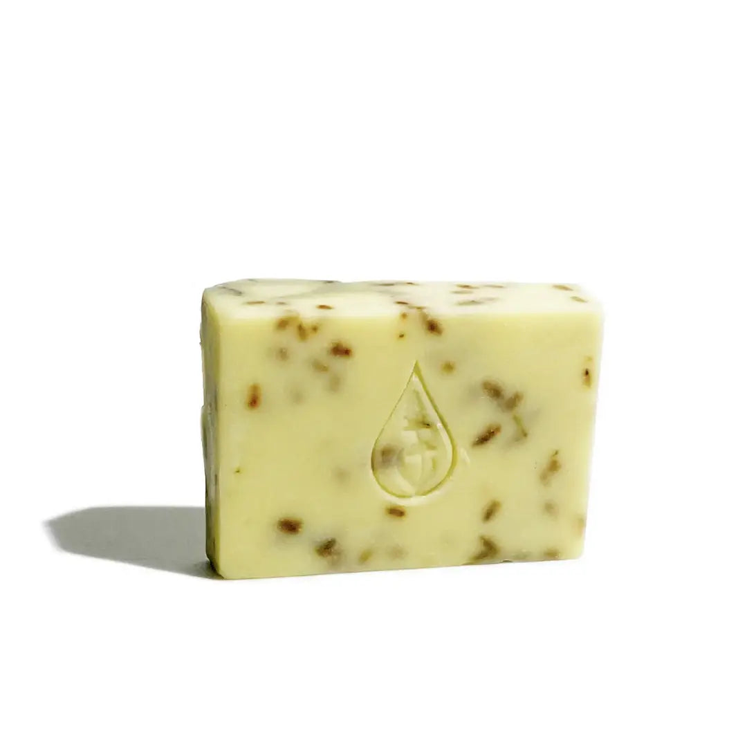 By Valenti Lavender & Lime bar soap with a stamped brand logo on a white background