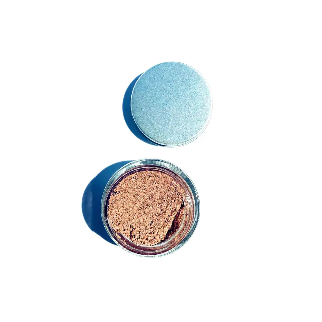 By Valenti cosmetic container with red exfoliating clay mask on a white background